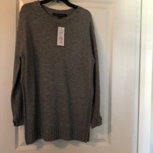Grey sweater with slit up the side. Never worn.
